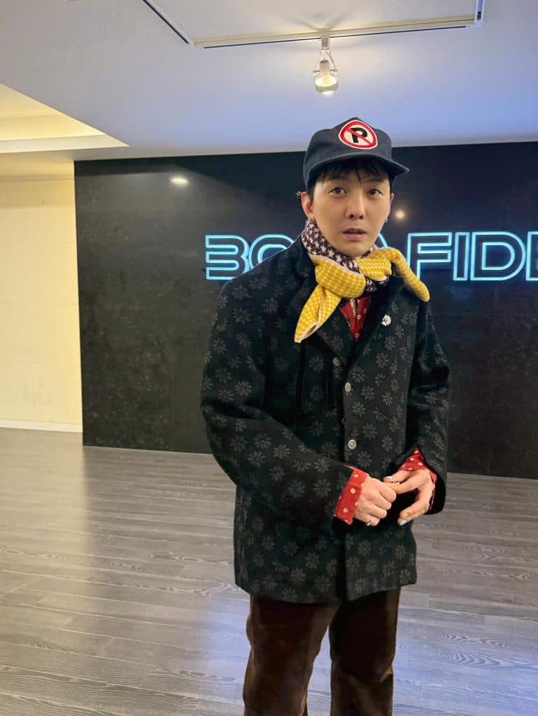 G-Dragon proves caps are the ultimate style hack